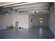 Spacious two-car garage with high ceilings and epoxy flooring at 7493 Estuary Lake Loop, Kissimmee, FL 34747