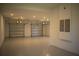 Bright and spacious three-car garage with epoxy flooring at 7493 Estuary Lake Loop, Kissimmee, FL 34747