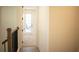 Bright hallway with door to bedroom and balcony access at 7493 Estuary Lake Loop, Kissimmee, FL 34747