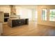 Modern kitchen with large island, stainless steel appliances, and white cabinets at 7493 Estuary Lake Loop, Kissimmee, FL 34747