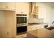 Modern kitchen with stainless steel appliances and a large island at 7493 Estuary Lake Loop, Kissimmee, FL 34747