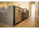 Stainless steel dishwasher nestled in modern kitchen cabinets at 7493 Estuary Lake Loop, Kissimmee, FL 34747