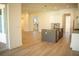 Open concept kitchen with island overlooking living area at 7493 Estuary Lake Loop, Kissimmee, FL 34747