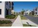 Street view of a residential neighborhood with houses and landscaping at 7493 Estuary Lake Loop, Kissimmee, FL 34747