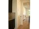 Modern pantry with dark cabinetry and herringbone backsplash at 7493 Estuary Lake Loop, Kissimmee, FL 34747