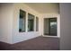 Brick paved patio with covered section and access to interior from sliding glass doors at 7493 Estuary Lake Loop, Kissimmee, FL 34747