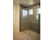 Large walk-in shower with gray tile and glass enclosure at 7493 Estuary Lake Loop, Kissimmee, FL 34747