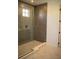 Large walk-in shower with gray tile and glass enclosure at 7493 Estuary Lake Loop, Kissimmee, FL 34747