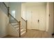 Modern staircase with dark metal railing and light wood steps at 7493 Estuary Lake Loop, Kissimmee, FL 34747