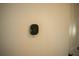 Digital thermostat mounted on a white wall at 7493 Estuary Lake Loop, Kissimmee, FL 34747