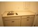 Built-in wet bar with sink and cabinetry, perfect for entertaining at 7493 Estuary Lake Loop, Kissimmee, FL 34747