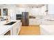 Modern kitchen with stainless steel appliances and white cabinetry at 10236 Chorlton Cir, Orlando, FL 32832