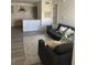 Cozy living room featuring a gray sofa and a large area rug at 2208 Antigua Pl # 924, Kissimmee, FL 34741
