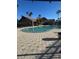 Community pool with clubhouse and palm trees at 2208 Antigua Pl # 924, Kissimmee, FL 34741