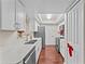 Modern kitchen featuring white cabinetry, stainless steel appliances, and wood flooring at 2742 Fireside Ct, Orlando, FL 32839