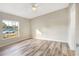 Bright bedroom with laminate wood flooring and large window at 2917 Crockett Pt, Sanford, FL 32773