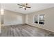 Living room with laminate flooring, ceiling fan, and view to kitchen at 2917 Crockett Pt, Sanford, FL 32773