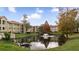 Lovely community pond with fountain and landscaping at 3032 Parkway Blvd # 302, Kissimmee, FL 34747