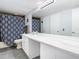 Bathroom with a double vanity and navy blue shower curtain at 3692 Okeechobee Cir, Casselberry, FL 32707