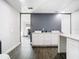 Double vanity bathroom with white cabinets and dark floors at 3692 Okeechobee Cir, Casselberry, FL 32707