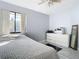 Cozy bedroom with a bed and dresser at 3692 Okeechobee Cir, Casselberry, FL 32707
