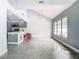 Kitchen with gray cabinets, breakfast bar, and tile floors at 3692 Okeechobee Cir, Casselberry, FL 32707