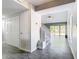 Living room with tile floors, staircase, and access to the backyard at 3692 Okeechobee Cir, Casselberry, FL 32707