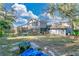 Large backyard with screened pool and spacious patio area at 4012 Moorings Ln # 1, Orlando, FL 32810