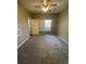 Spacious bedroom with ceiling fan and window at 5028 City St # 2017, Orlando, FL 32839