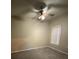 Carpeted bedroom with ceiling fan and window at 5028 City St # 2017, Orlando, FL 32839