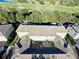 Aerial view of townhouses with private patios and a golf course nearby at 7128 Five Oaks Dr, Harmony, FL 34773