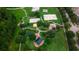 Aerial view of a community park with lush green spaces and recreational areas at 7128 Five Oaks Dr, Harmony, FL 34773