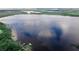 Breathtaking aerial view of a peaceful lake at 7128 Five Oaks Dr, Harmony, FL 34773