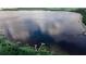 Stunning aerial view of a serene lake at 7128 Five Oaks Dr, Harmony, FL 34773