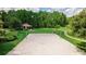 Sand volleyball court with surrounding park amenities at 7128 Five Oaks Dr, Harmony, FL 34773