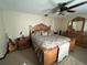 Main bedroom with a king-size bed and wood furniture at 947 Citrus Wood Ct, Longwood, FL 32750