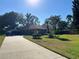 Single-story home with a two-car garage and spacious yard at 947 Citrus Wood Ct, Longwood, FL 32750