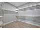 Large walk-in closet with ample shelving for storage at 113 Douglas St, Edgewater, FL 32141