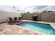 Small pool and patio area with modern furniture and grill at 212 Villa Domani Cir, Davenport, FL 33896