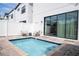 Small, private pool and patio area with modern furniture at 212 Villa Domani Cir, Davenport, FL 33896