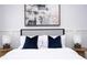 Bedroom with a queen bed, gray headboard, and blue pillows at 212 Villa Domani Cir, Davenport, FL 33896