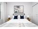 Bedroom with a queen bed, gray headboard and blue pillows at 212 Villa Domani Cir, Davenport, FL 33896