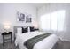 Bedroom with a king bed, gray headboard, and green throw at 212 Villa Domani Cir, Davenport, FL 33896