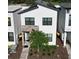 Modern two-story home with solar panels and stone accents at 212 Villa Domani Cir, Davenport, FL 33896