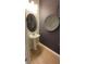 Powder room with pedestal sink and unique wall decor at 2774 Bright Bird Ln, Winter Park, FL 32792