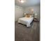 Guest bedroom with a queen-size bed and neutral color palette at 2774 Bright Bird Ln, Winter Park, FL 32792