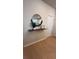 Light and bright entryway with wood floors and a stylish shelf at 2774 Bright Bird Ln, Winter Park, FL 32792
