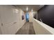 Upstairs hallway with carpet and access to bedrooms at 2774 Bright Bird Ln, Winter Park, FL 32792