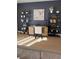Home office with a desk, shelving, and artwork at 2774 Bright Bird Ln, Winter Park, FL 32792