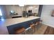 Modern kitchen island with seating for three at 2774 Bright Bird Ln, Winter Park, FL 32792
